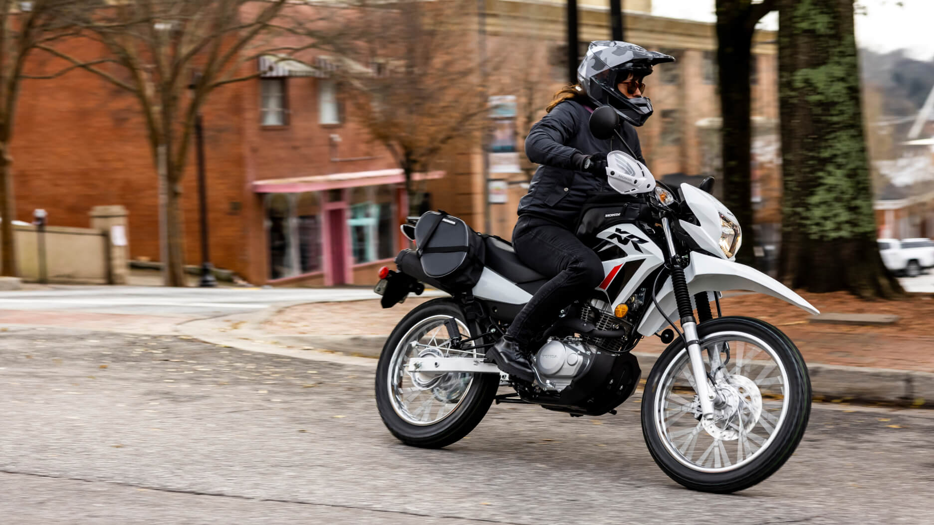A rider taking a corner on a Honda XR150L
