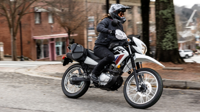 Rider on XR150L going left in street.